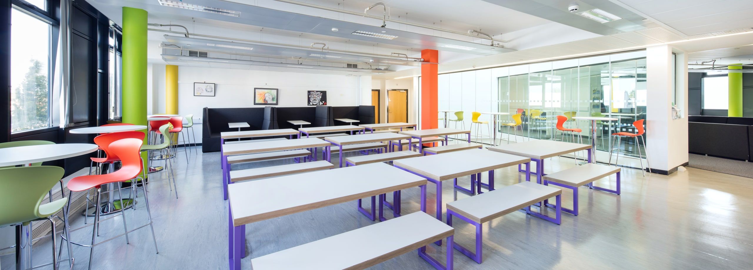 Canteen tables on purple frames beneath the orange column, 6th Form Centre, St Bartholomew's School, Newbury.