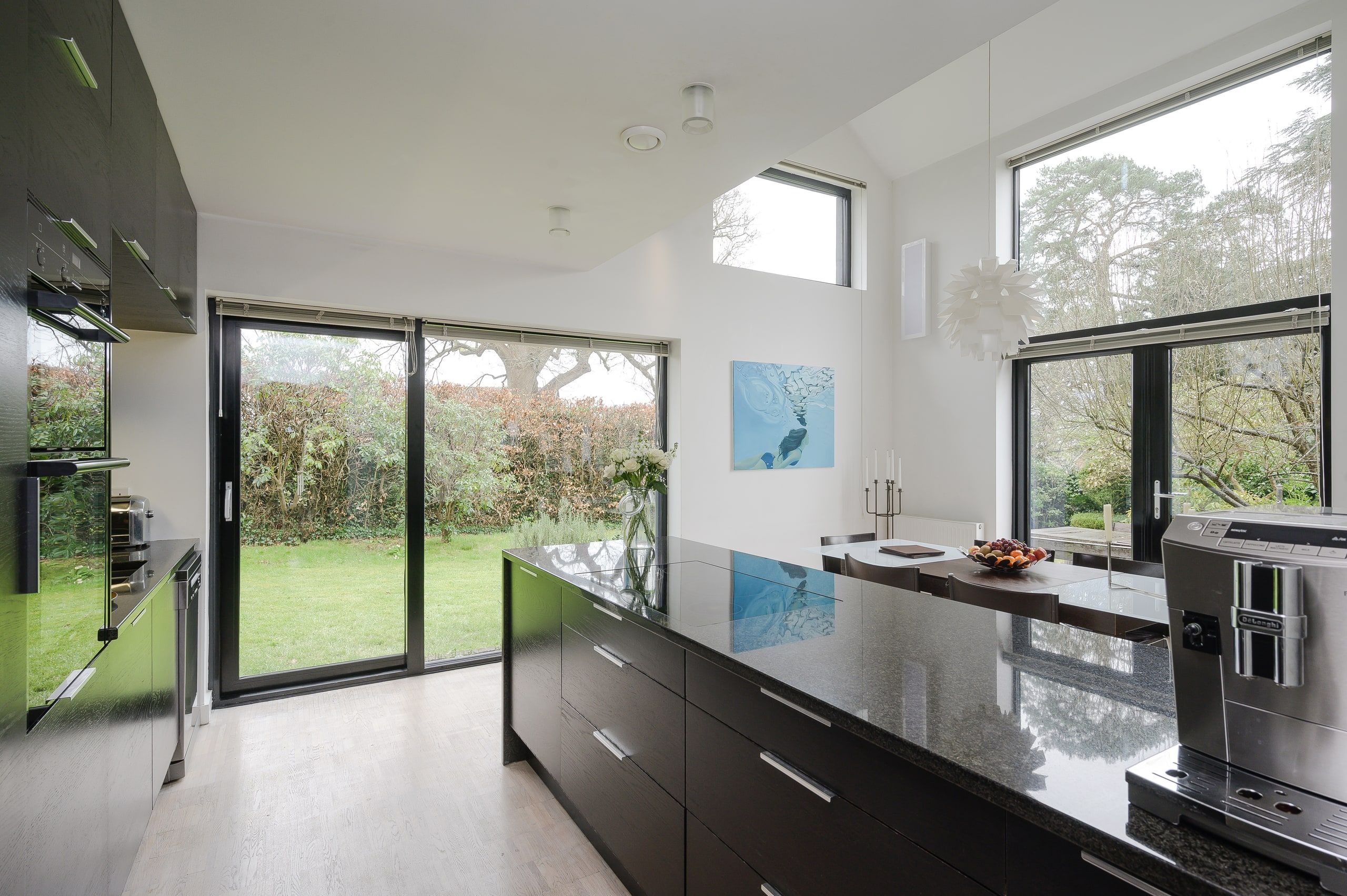 Full-height glazing along the open-plan kitchen run, 1960s house, Fernhurst.