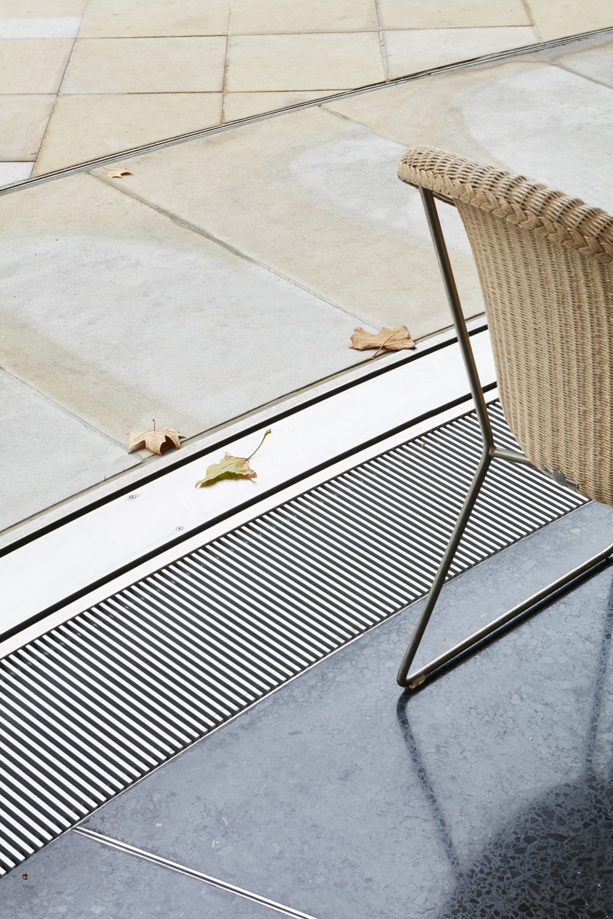 Detail of the slot in the stone paving into which the facade descends, restaurant pavilion, Duke of York Square, London.